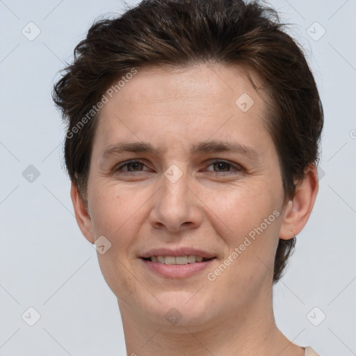 Joyful white adult female with short  brown hair and brown eyes