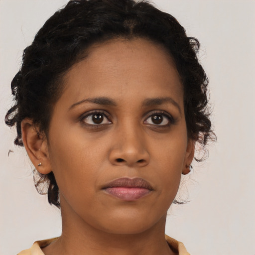 Neutral black young-adult female with short  brown hair and brown eyes