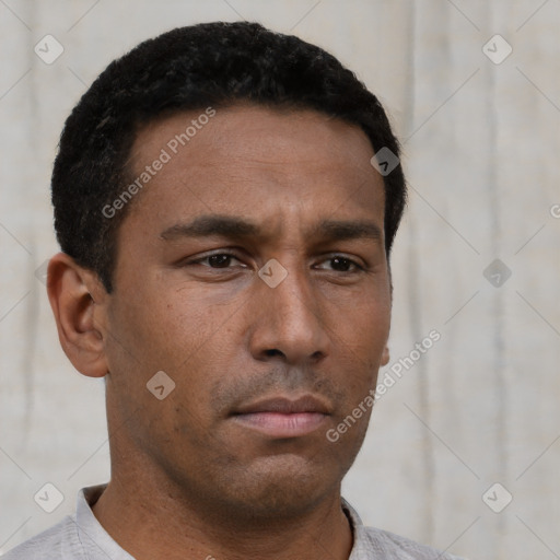 Neutral latino young-adult male with short  brown hair and brown eyes
