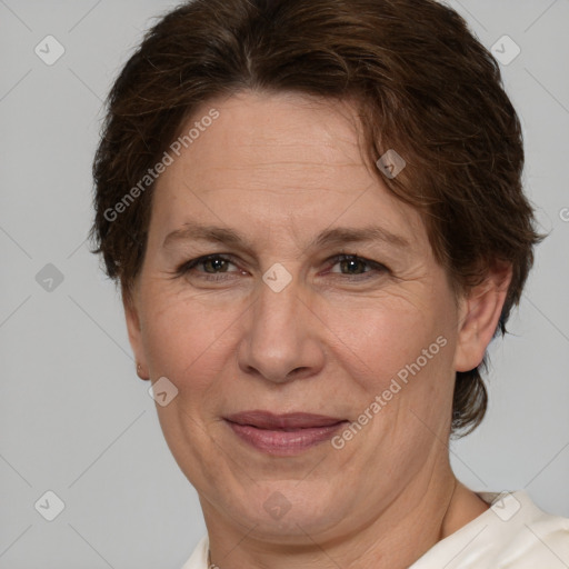 Joyful white adult female with short  brown hair and brown eyes