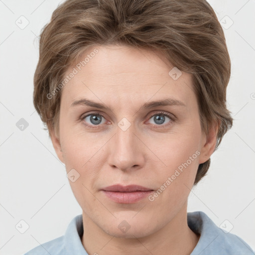 Joyful white adult female with short  brown hair and grey eyes