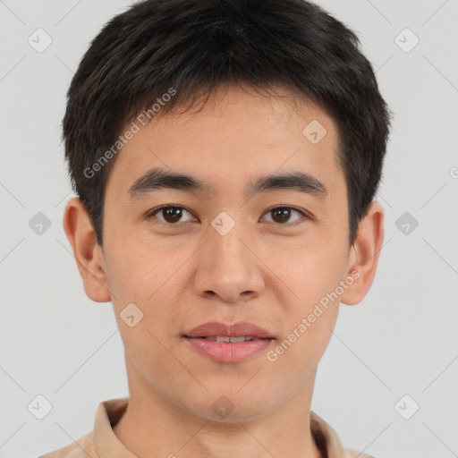 Joyful asian young-adult male with short  brown hair and brown eyes