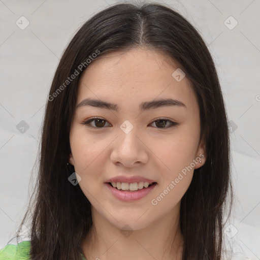 Joyful asian young-adult female with long  brown hair and brown eyes