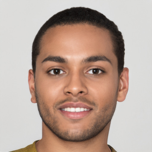 Joyful latino young-adult male with short  brown hair and brown eyes