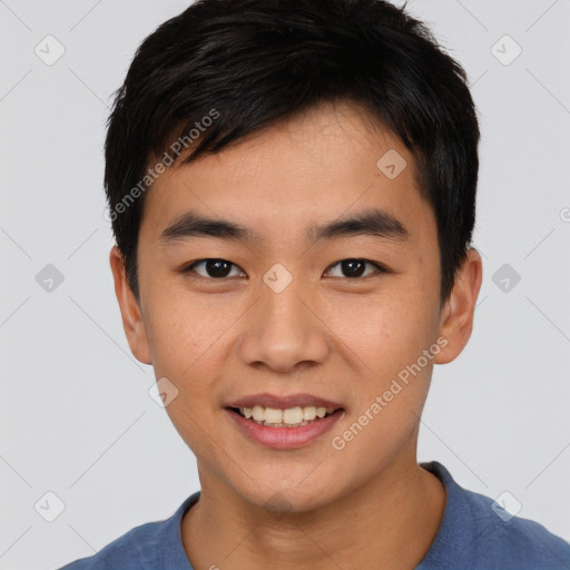 Joyful asian young-adult male with short  black hair and brown eyes