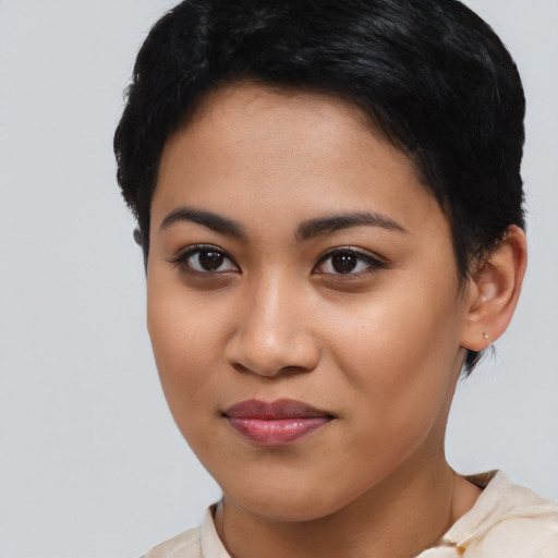 Joyful asian young-adult female with short  brown hair and brown eyes