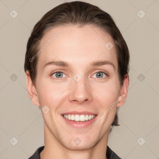 Joyful white young-adult female with short  brown hair and grey eyes