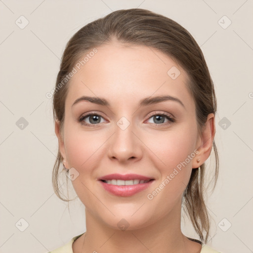 Joyful white young-adult female with medium  brown hair and grey eyes