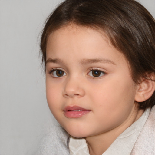 Joyful white child female with medium  brown hair and brown eyes