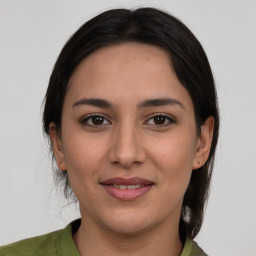 Joyful white young-adult female with medium  brown hair and brown eyes