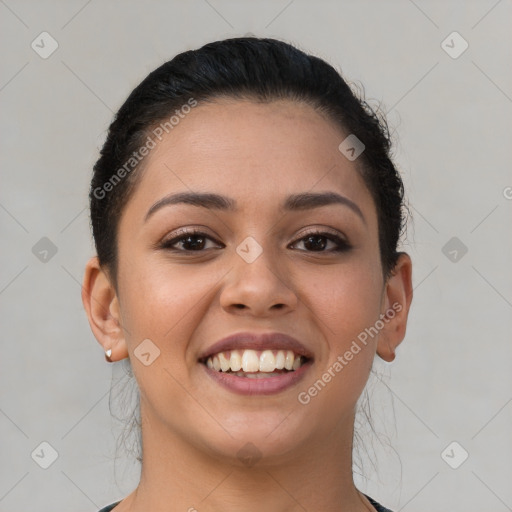 Joyful latino young-adult female with short  brown hair and brown eyes