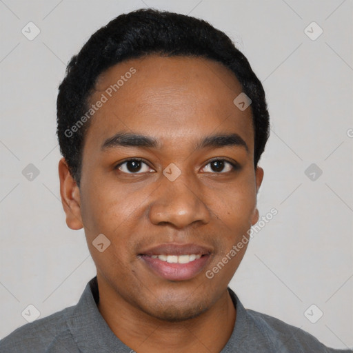 Joyful black young-adult male with short  black hair and brown eyes