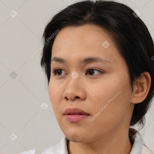 Neutral asian young-adult female with medium  brown hair and brown eyes