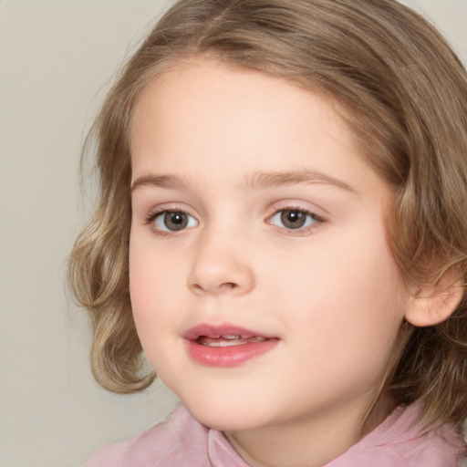 Joyful white child female with medium  brown hair and grey eyes