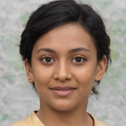 Joyful latino young-adult female with short  brown hair and brown eyes