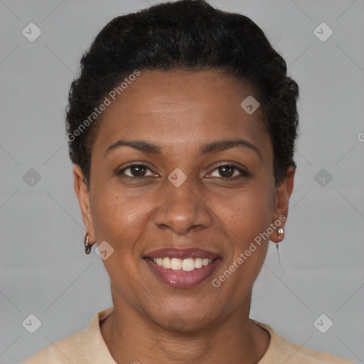 Joyful black adult female with short  brown hair and brown eyes