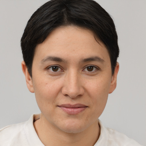 Joyful white adult female with short  brown hair and brown eyes