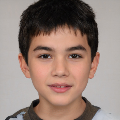 Joyful white child male with short  brown hair and brown eyes