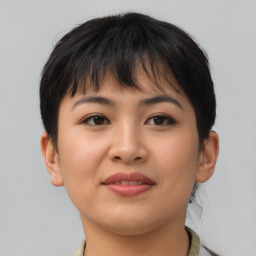 Joyful asian young-adult female with short  brown hair and brown eyes