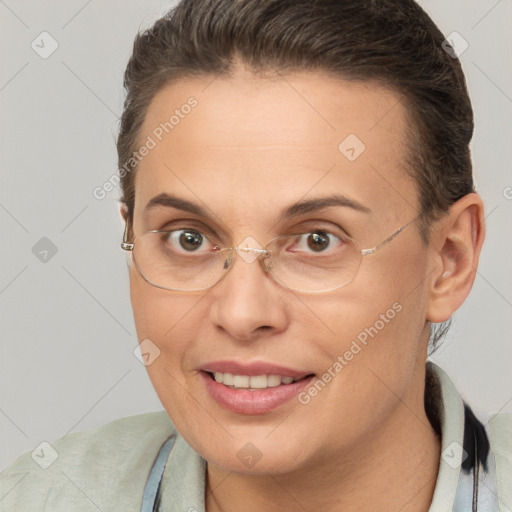 Joyful white adult female with short  brown hair and brown eyes