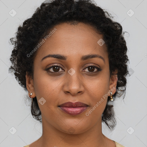 Joyful black young-adult female with medium  brown hair and brown eyes