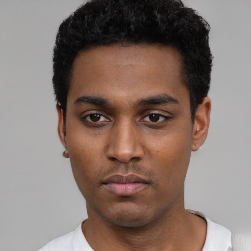 Neutral black young-adult male with short  black hair and brown eyes