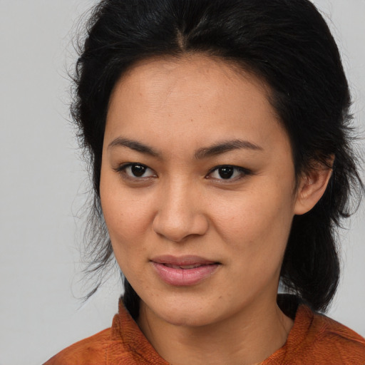 Joyful asian young-adult female with medium  brown hair and brown eyes