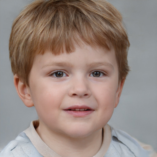 Joyful white child male with short  brown hair and blue eyes