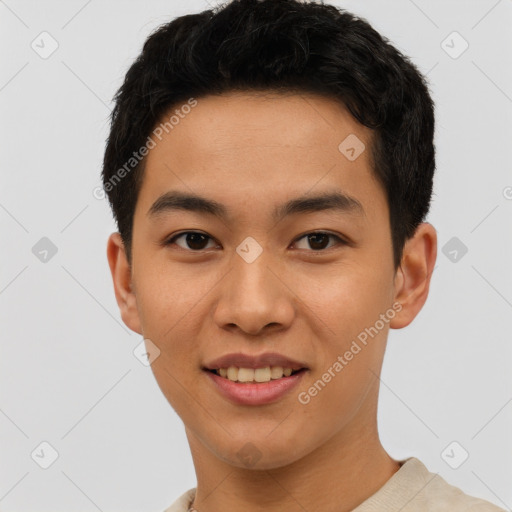 Joyful asian young-adult male with short  black hair and brown eyes