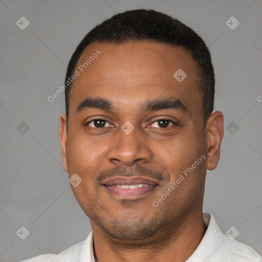 Joyful latino young-adult male with short  black hair and brown eyes