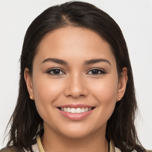 Joyful white young-adult female with long  brown hair and brown eyes