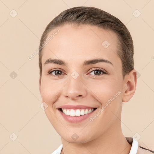 Joyful white young-adult female with short  brown hair and brown eyes