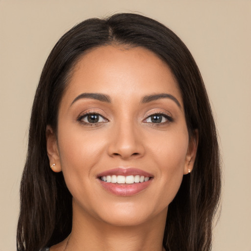 Joyful white young-adult female with long  brown hair and brown eyes