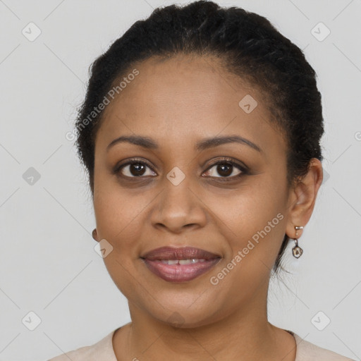 Joyful latino adult female with short  brown hair and brown eyes