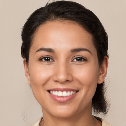 Joyful white young-adult female with medium  brown hair and brown eyes