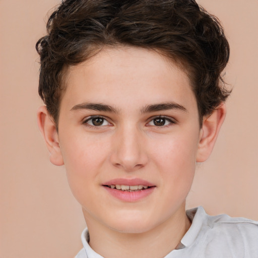 Joyful white child male with short  brown hair and brown eyes