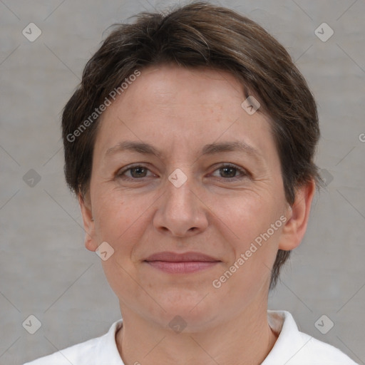 Joyful white adult female with short  brown hair and brown eyes