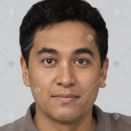 Joyful latino young-adult male with short  black hair and brown eyes