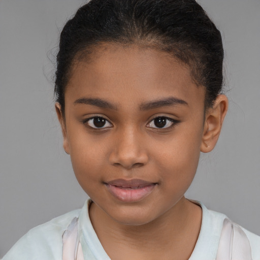 Joyful latino child female with short  brown hair and brown eyes