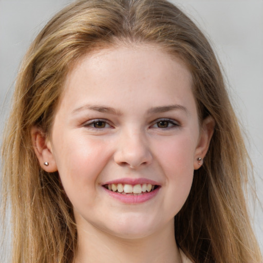 Joyful white child female with long  brown hair and brown eyes