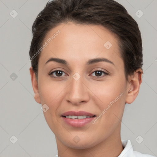 Joyful white young-adult female with short  brown hair and brown eyes