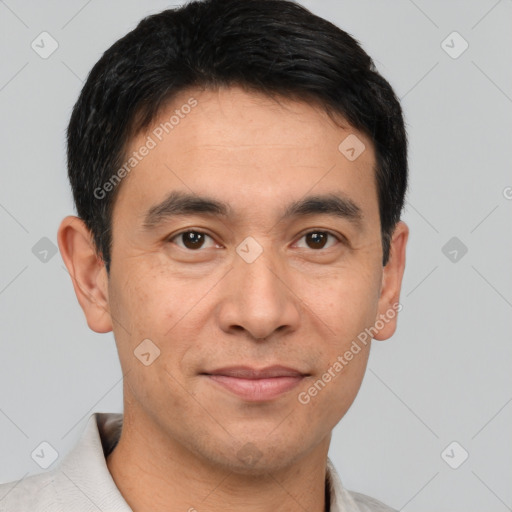 Joyful white adult male with short  black hair and brown eyes