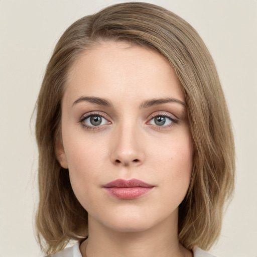 Neutral white young-adult female with medium  brown hair and green eyes