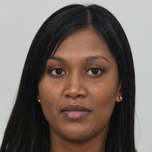 Joyful asian young-adult female with long  black hair and brown eyes