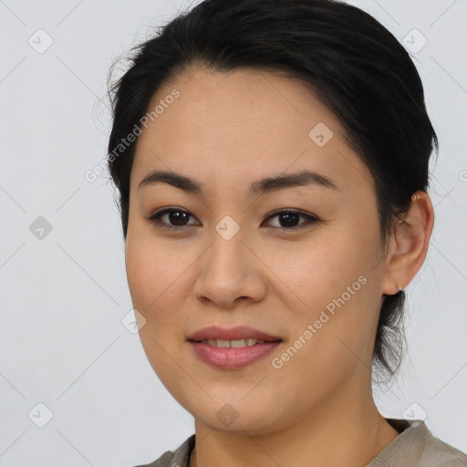 Joyful asian young-adult female with medium  brown hair and brown eyes