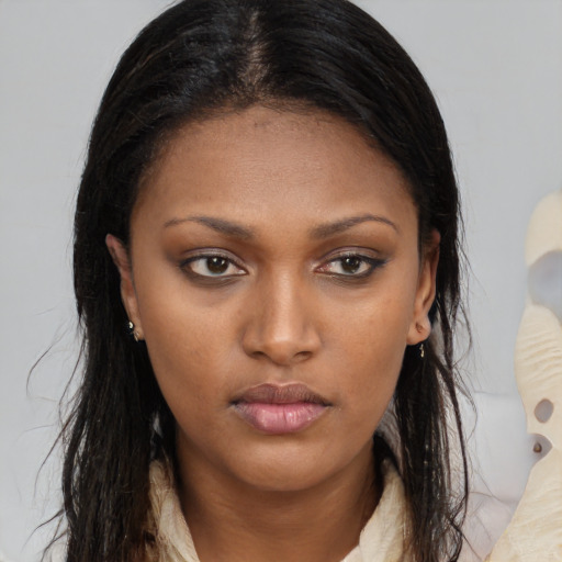 Neutral black young-adult female with long  brown hair and brown eyes