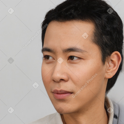 Neutral asian young-adult male with short  black hair and brown eyes