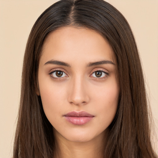 Neutral white young-adult female with long  brown hair and brown eyes