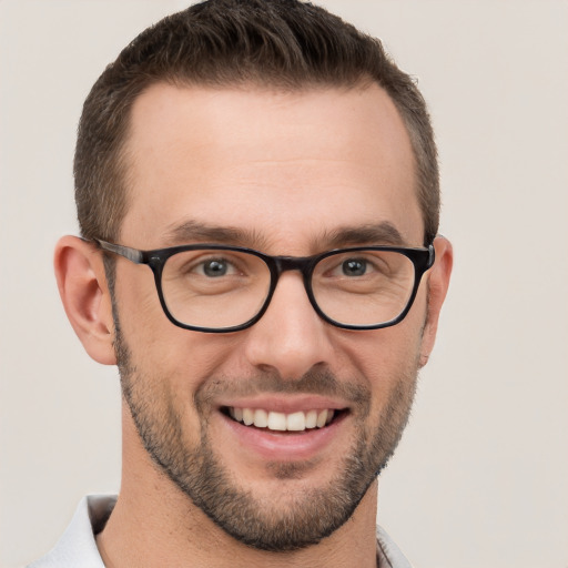 Joyful white young-adult male with short  brown hair and brown eyes