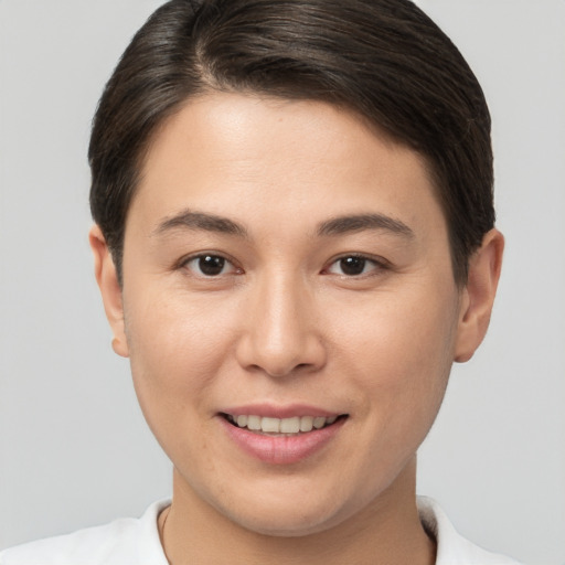 Joyful white young-adult female with short  brown hair and brown eyes
